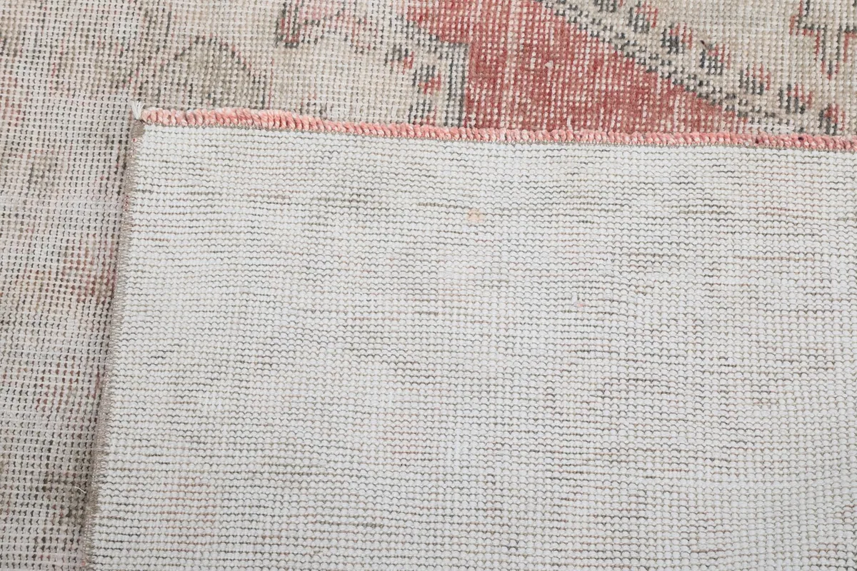 Close-up of the rug's back, showing the tight hand-knotted construction