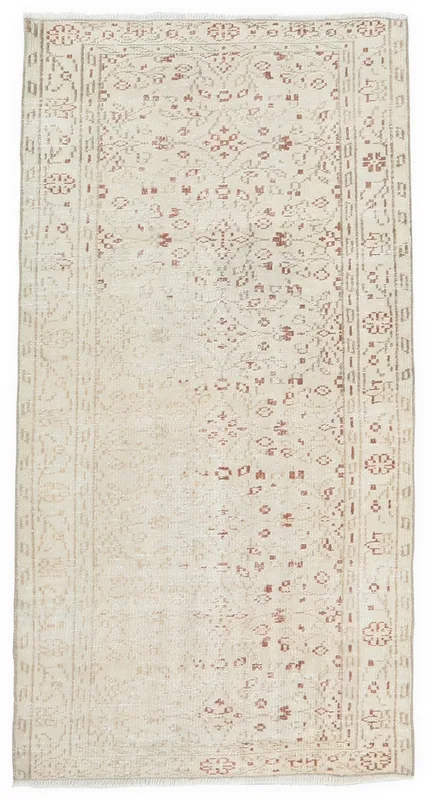 Full overhead view of ivory and rust hand-knotted vintage Anatolian area rug
