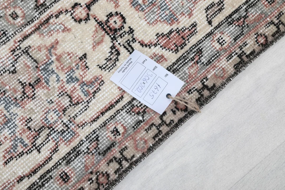Tag on the back of the rug displaying size and product information