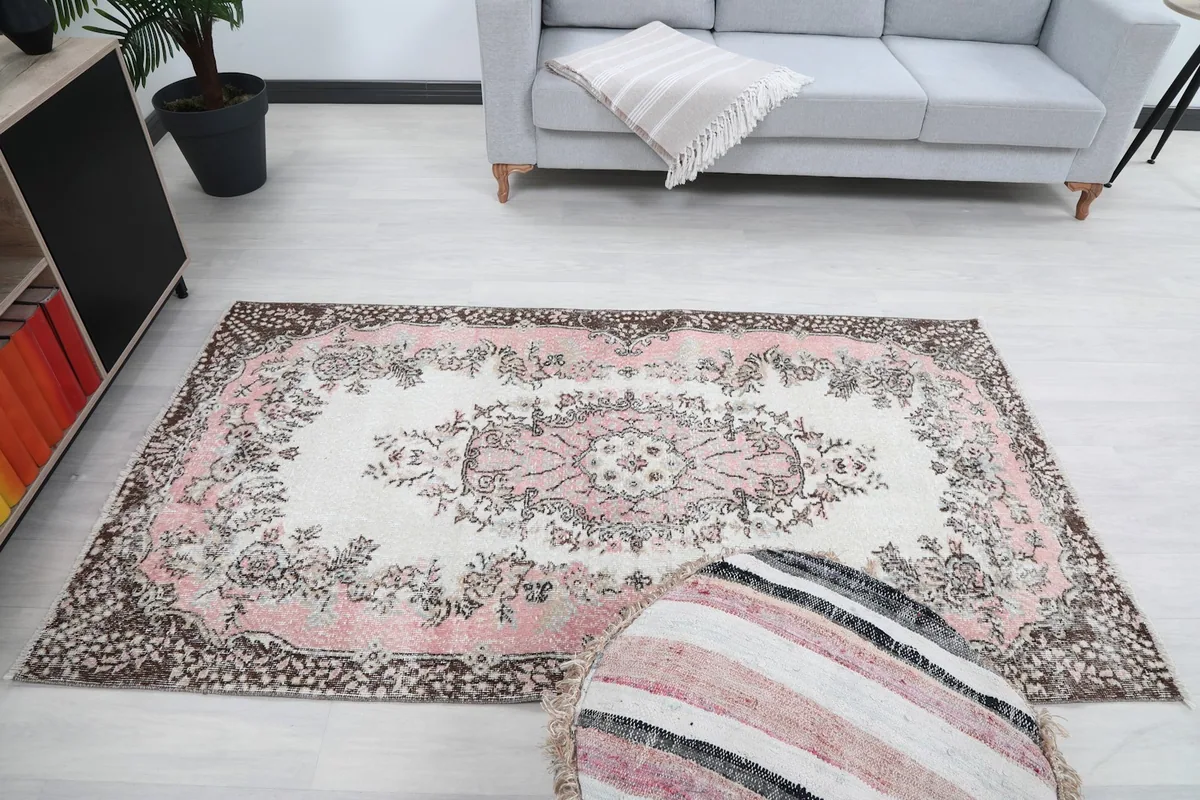 Straight-on view of the rug in a room, emphasizing its rectangular shape and central medallion