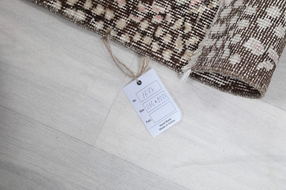 Close-up of the rug's edge and the product tag showing size and origin details