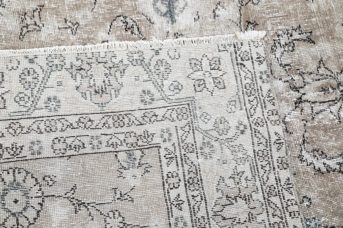Detailed view of the rug's back, showing the hand-knotted construction