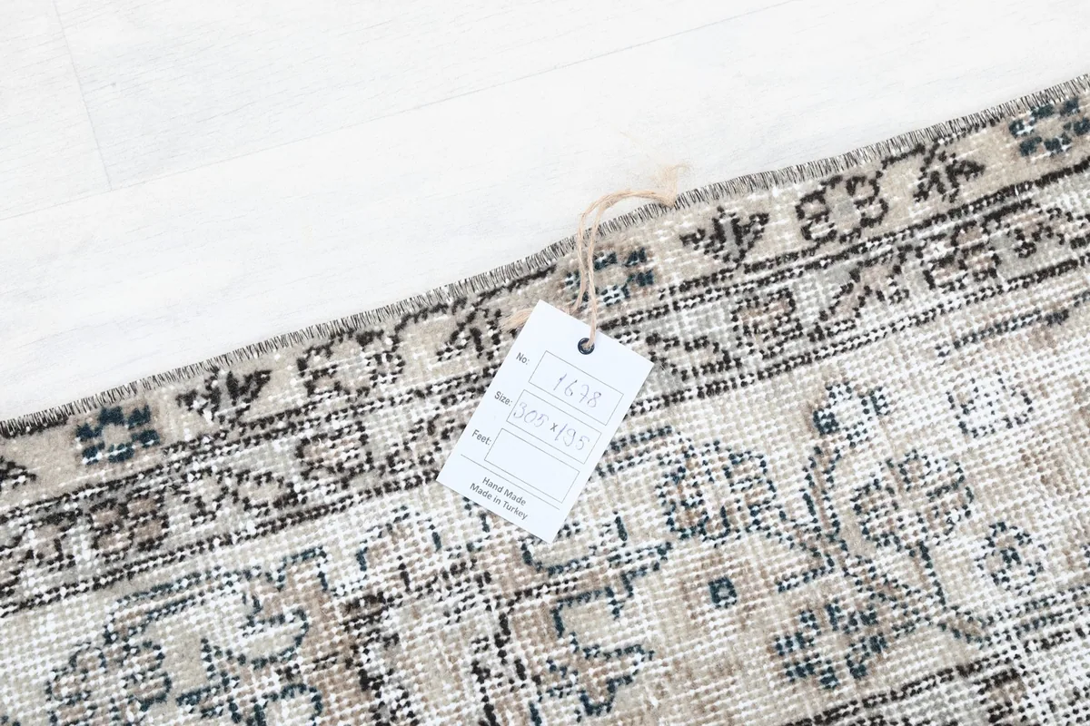 Close-up of the rug's edge with a product tag attached