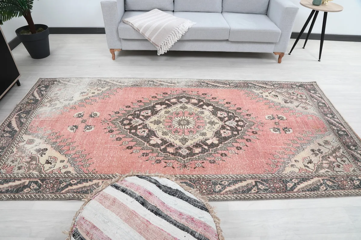 Wide shot of the rug in a room, offering a perspective on its size and how it anchors the space