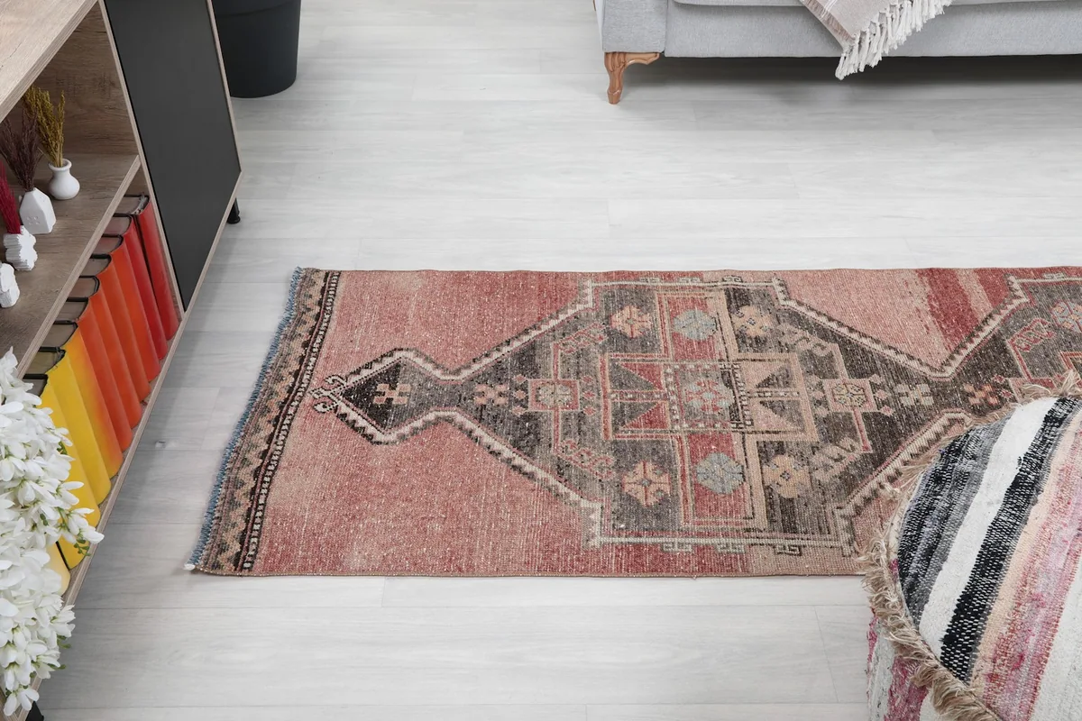 High-angle view of the runner rug stretching across a room, from a different perspective