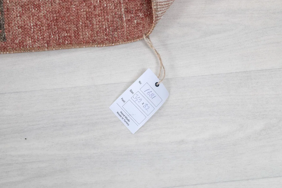 Product tag attached to the rug, displaying item number and size information