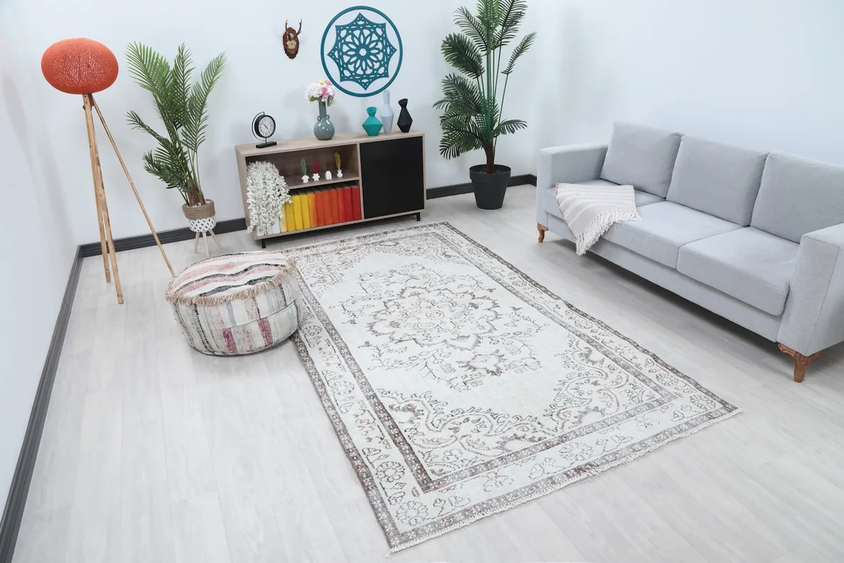 Cream Anatolian rug from an elevated angle, showing its placement in a modern living space.