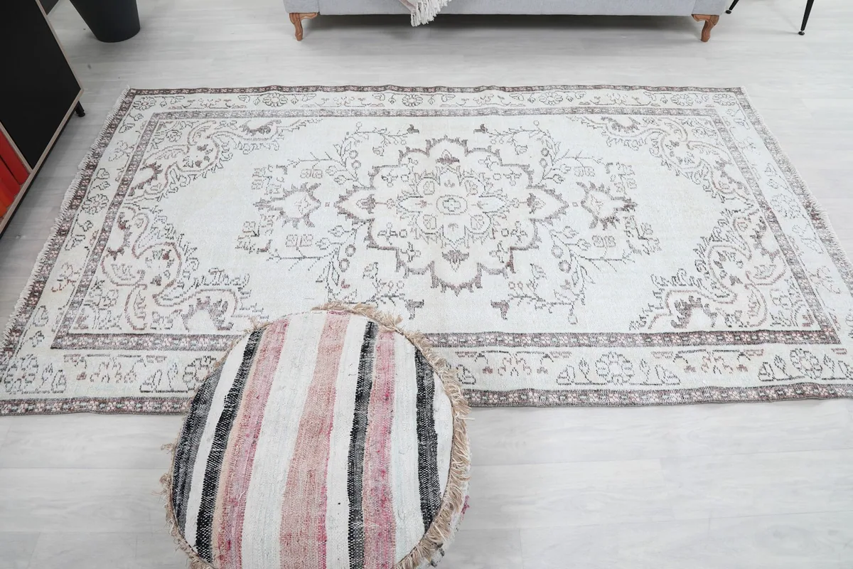 Full overhead view of the rug in a room, emphasizing its size and the overall design.
