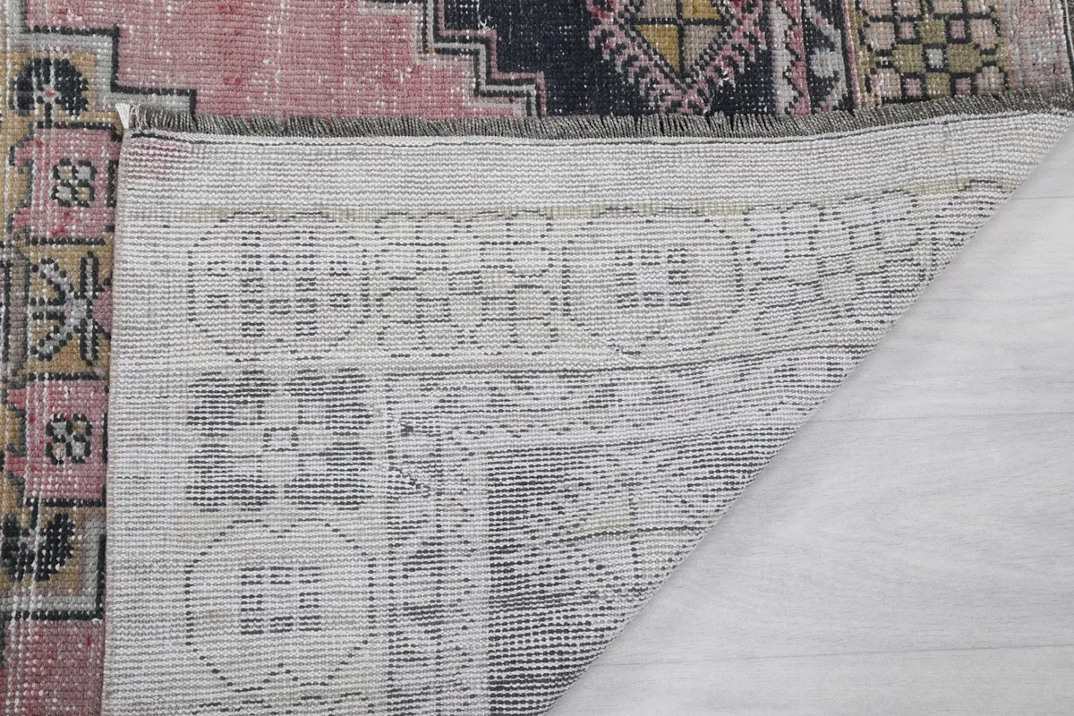 Close-up of the reverse side of the rug, showing the knotting and foundation details