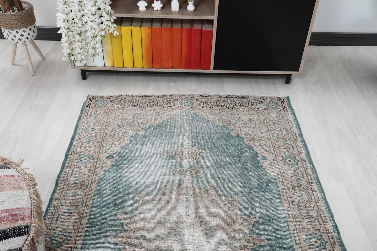 Overhead view of the vintage rug from one end, showcasing the design