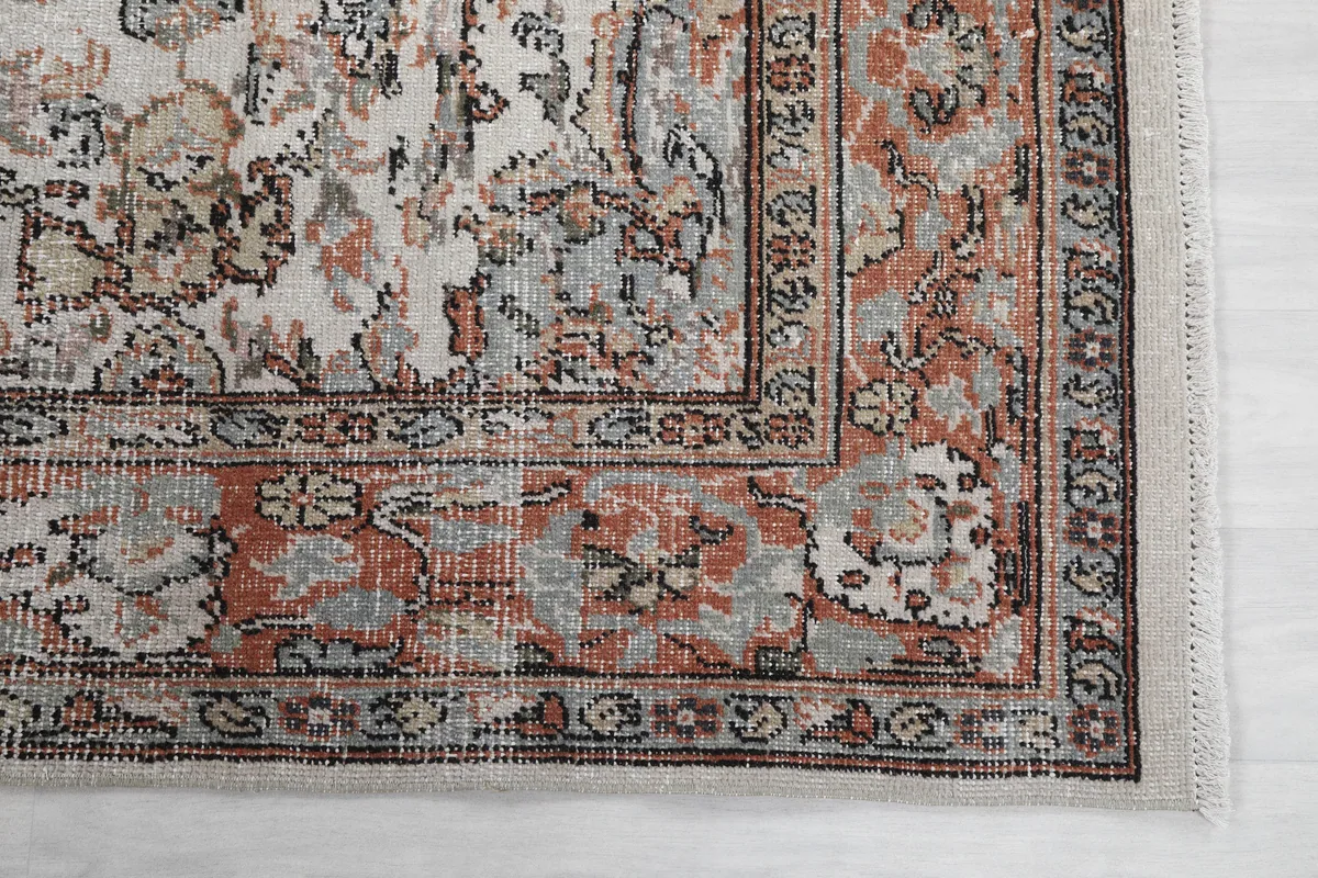 Cream Orange Floral Anatolian Rug corner detail, showing the intricate border design and fringe.