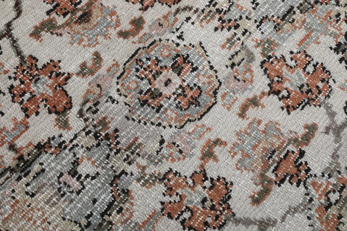 Cream Orange Floral Anatolian Rug detail of a central medallion element with soft color variations.