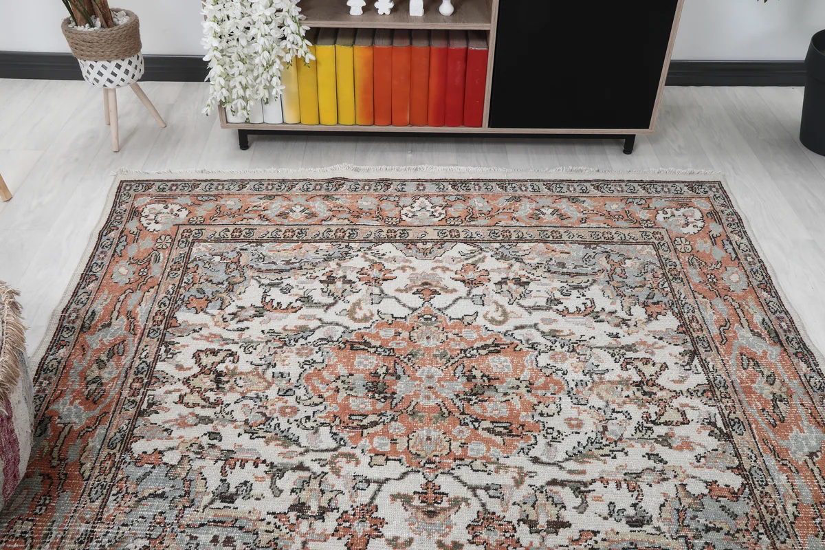 Cream Orange Floral Anatolian Rug in a room, capturing its overall look and feel.