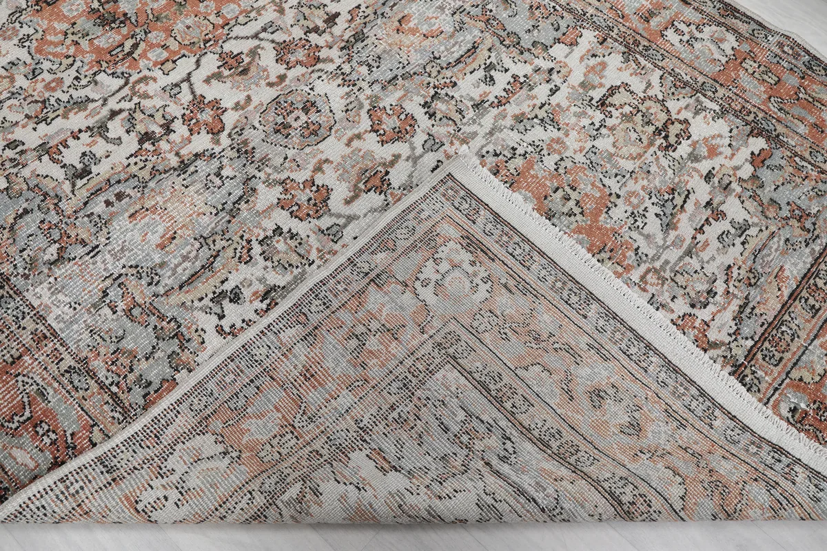 Cream Orange Floral Anatolian Rug flipped to show the hand-knotted cotton foundation and reverse side.