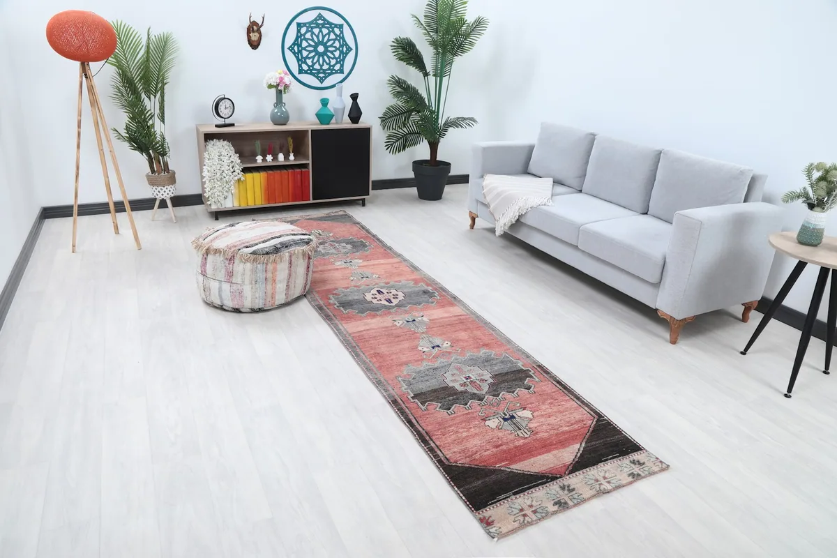 Angled view of the runner rug in a living space, showing its length and design elements