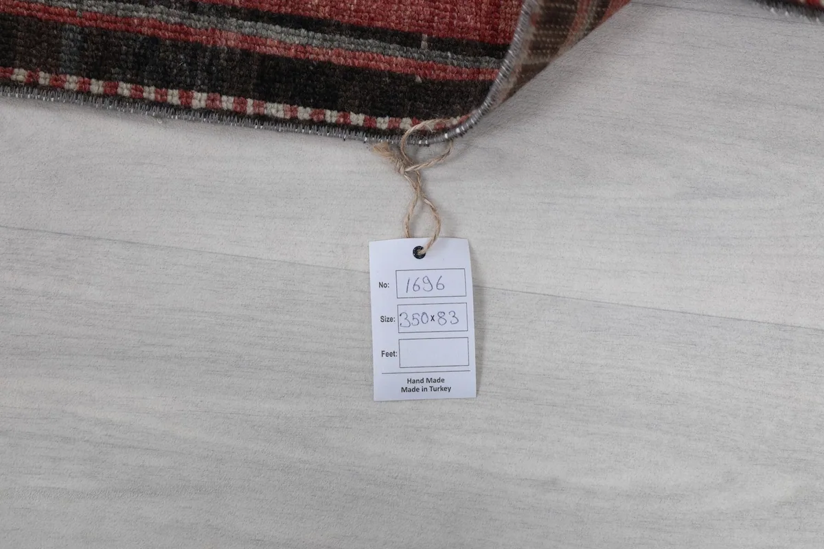 Close-up of the rug's tag, indicating its dimensions and origin
