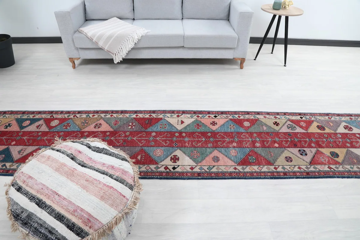 Wide shot of the runner rug in a room setting, showcasing its full length and impact