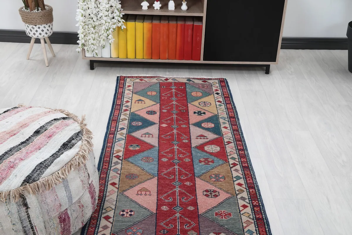 Overhead view of a section of the runner rug, highlighting its vibrant colors and geometric design