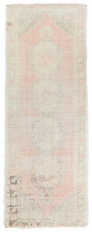 Full top view of the 3'1" x 8'5" vintage Anatolian runner rug with faded rose and ivory colors.