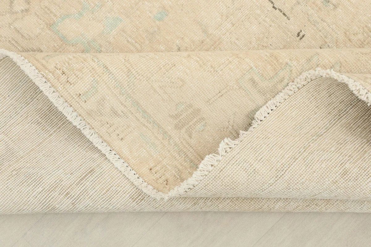 Detailed view of the reverse side of the rug, showing the hand-knotted construction and foundation