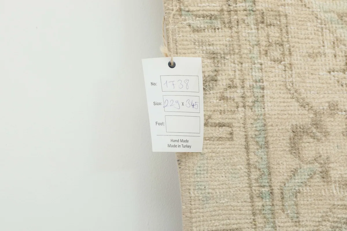 Close-up of the rug's tag showing size and origin details