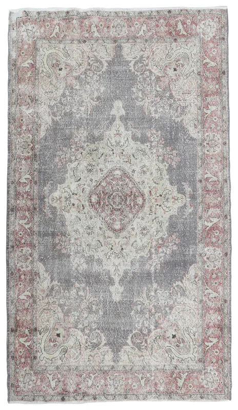 Full top view of the gray and rose floral medallion vintage Anatolian rug