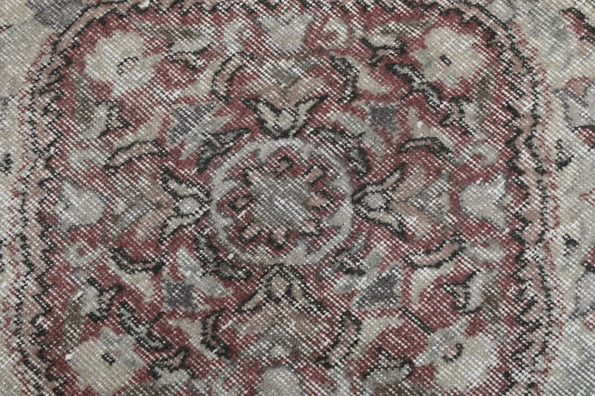 Close-up detail of the hand-knotted wool pile and intricate patterns