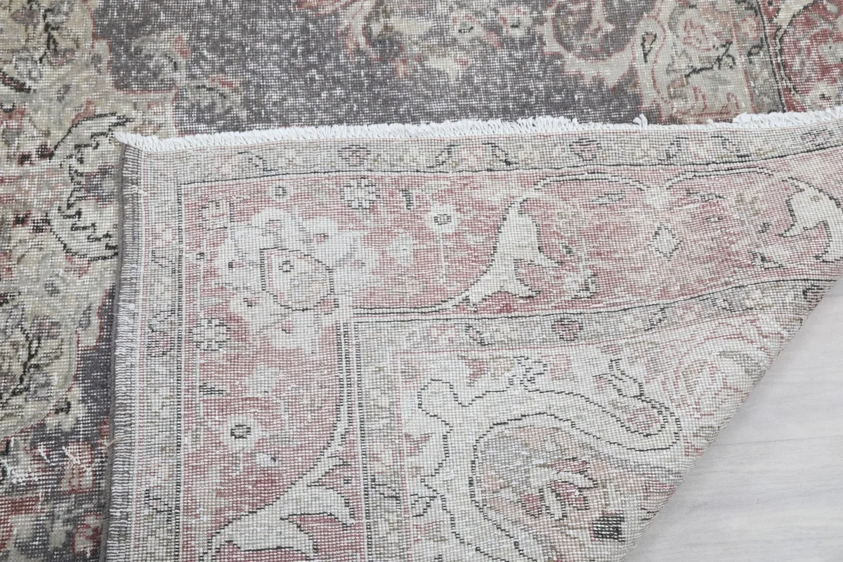 Detail of the rug's fringe and the reverse side of a corner
