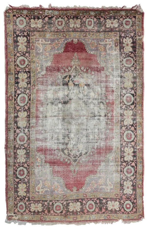 Full overhead view of the rose medallion distressed area rug on a white background