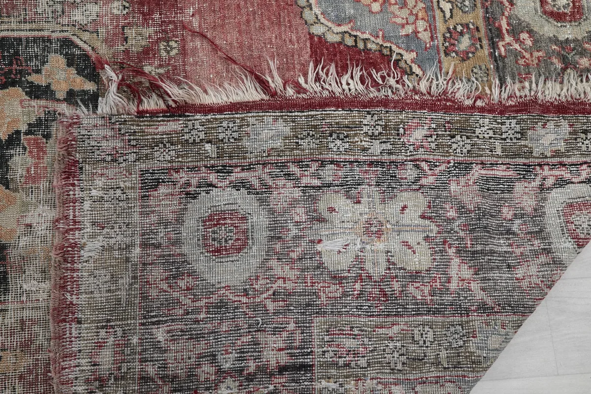 Close-up of the distressed fringe and the edge of the rug