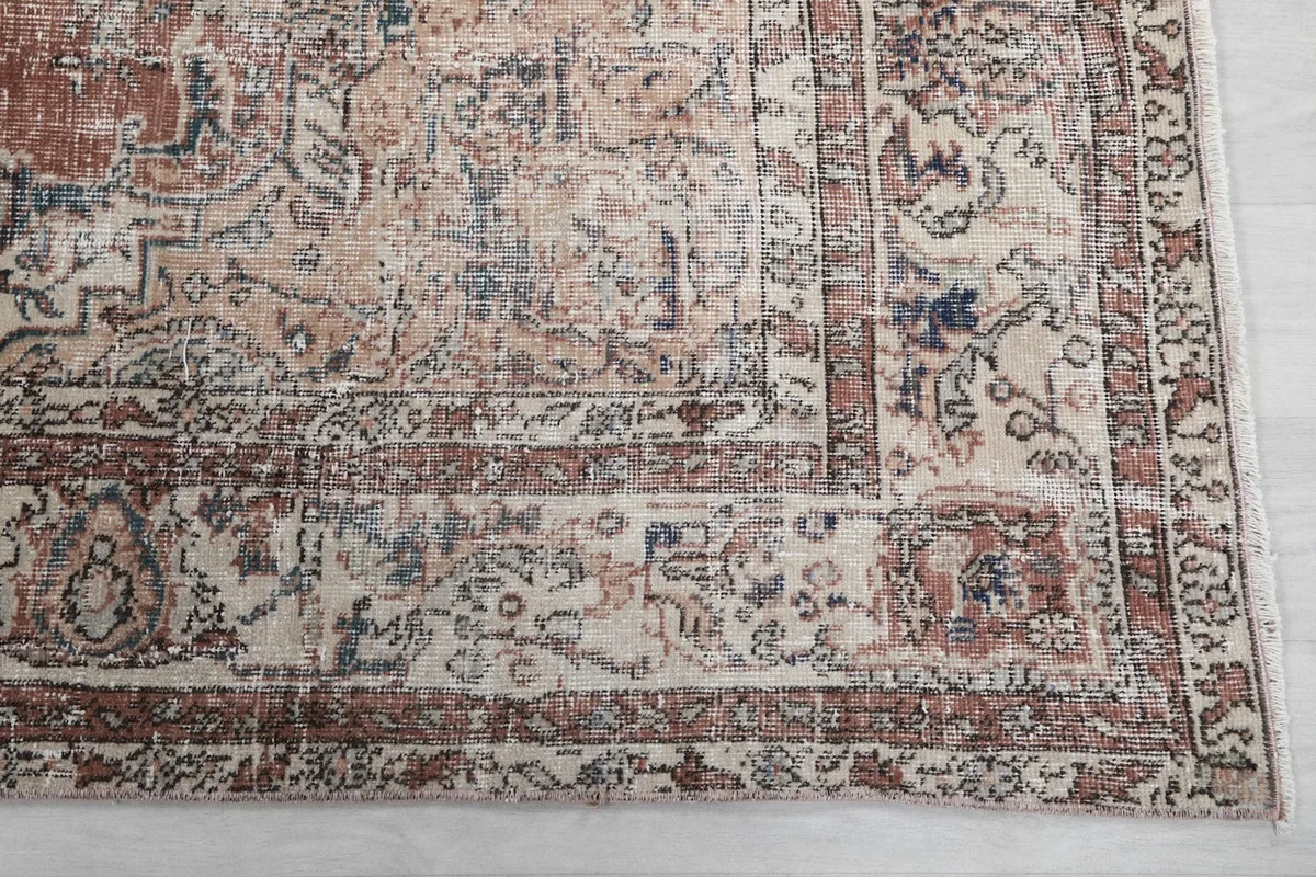 Detail of the rug's intricate border design and corner