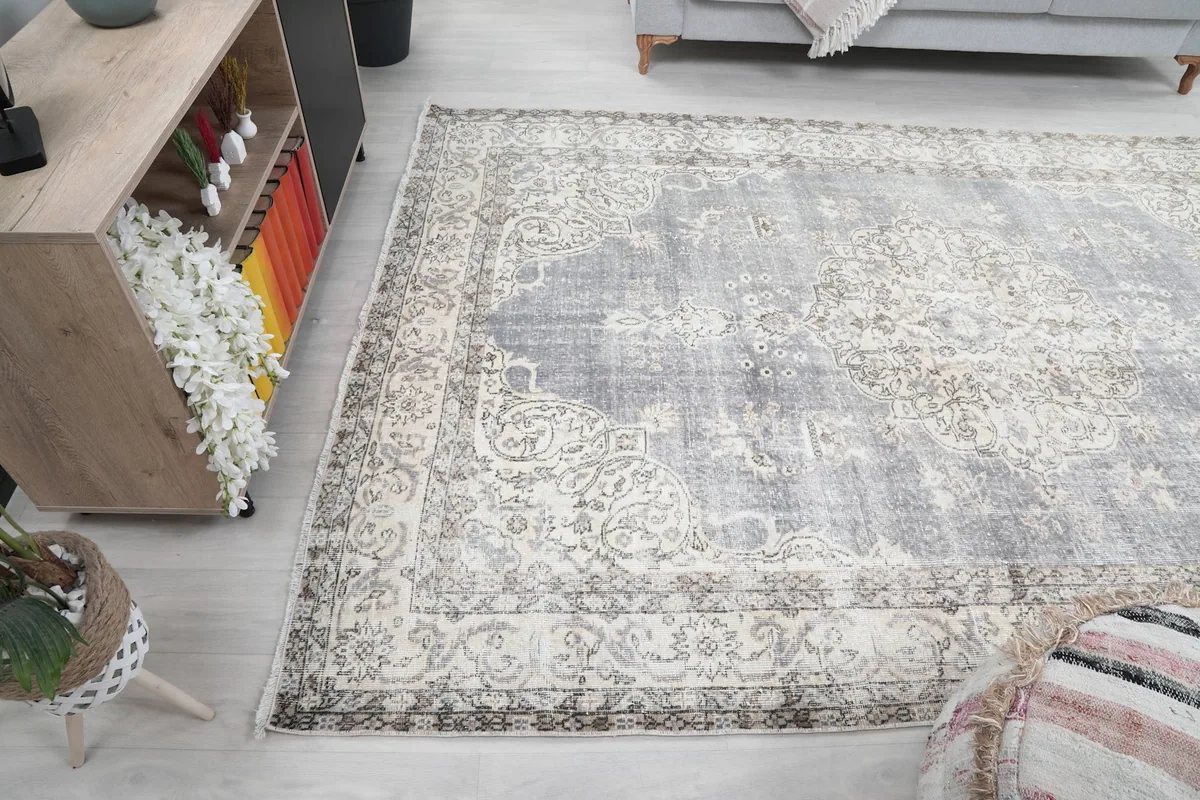 Wide shot of the rug in a room, illustrating how it fits beneath furniture.