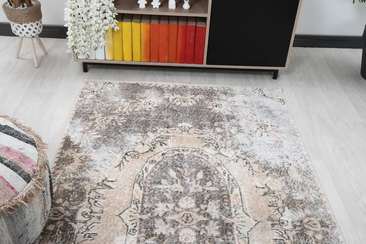 Overhead view of the rug in a room, highlighting its position relative to furniture