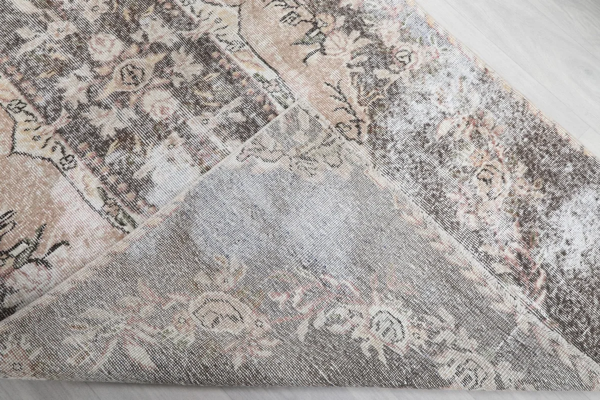 Underside of the rug, showing the cotton foundation and reversed knotting