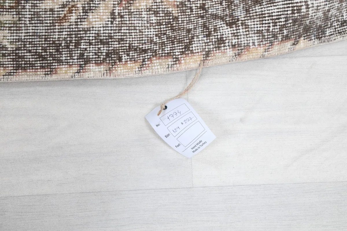 Product tag attached to the rug, displaying size and origin information