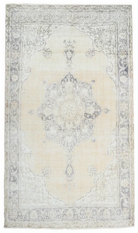 Full top view of the ivory and charcoal medallion vintage Anatolian rug.