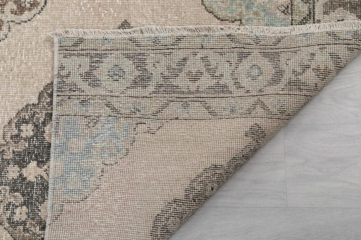 Another folded corner, revealing the back of the rug and its sturdy foundation.