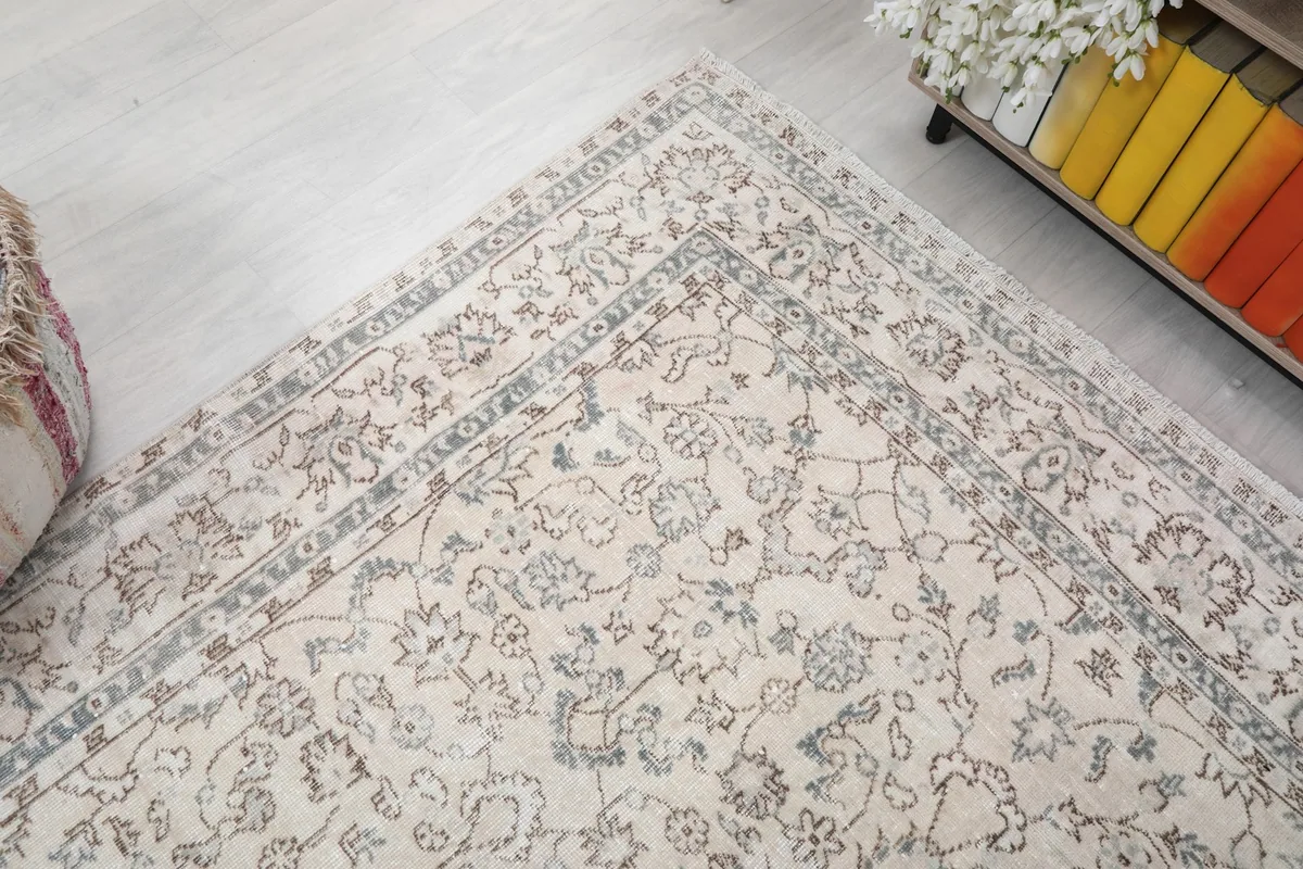 Corner view of the rug, illustrating the intricate border and central field patterns