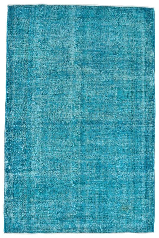Full overhead view of the blue vintage Anatolian area rug on a white background