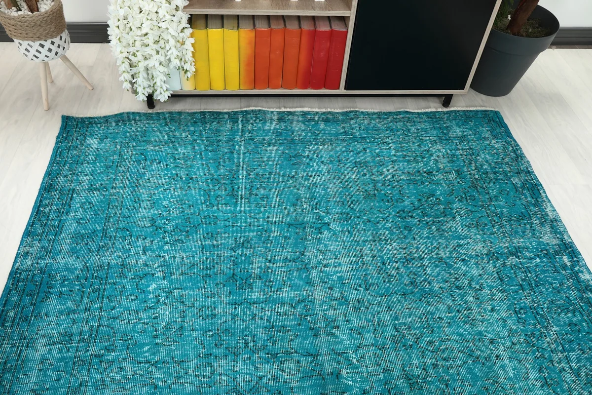 Overhead view of the rug in a room setting, showing its full dimensions and color consistency