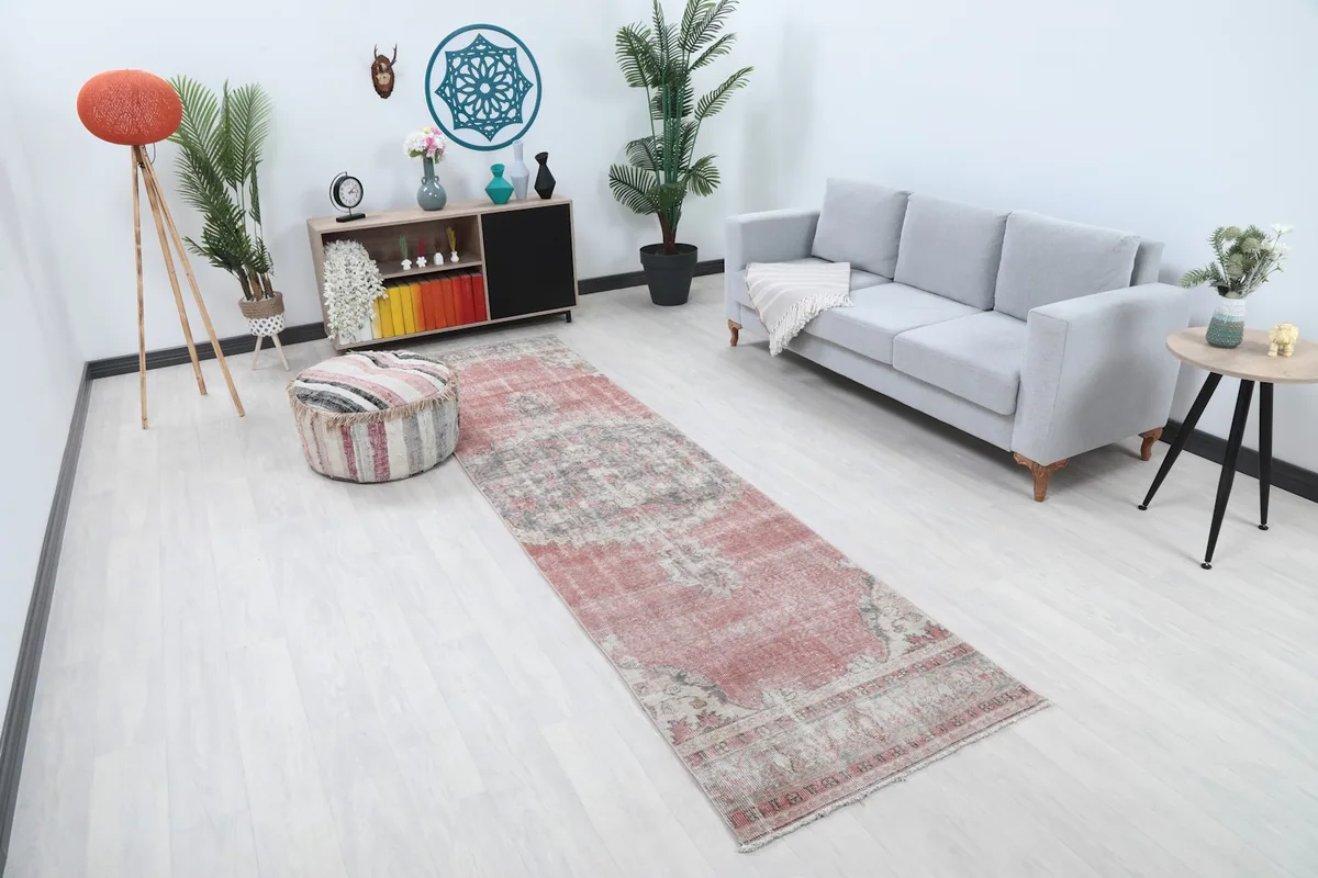 Angle view of the runner rug in a living space, showing its length and colors.