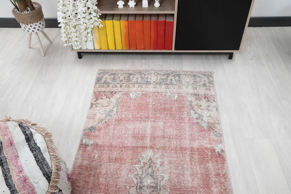 Overhead shot of the rug's top section, showing the border and field.