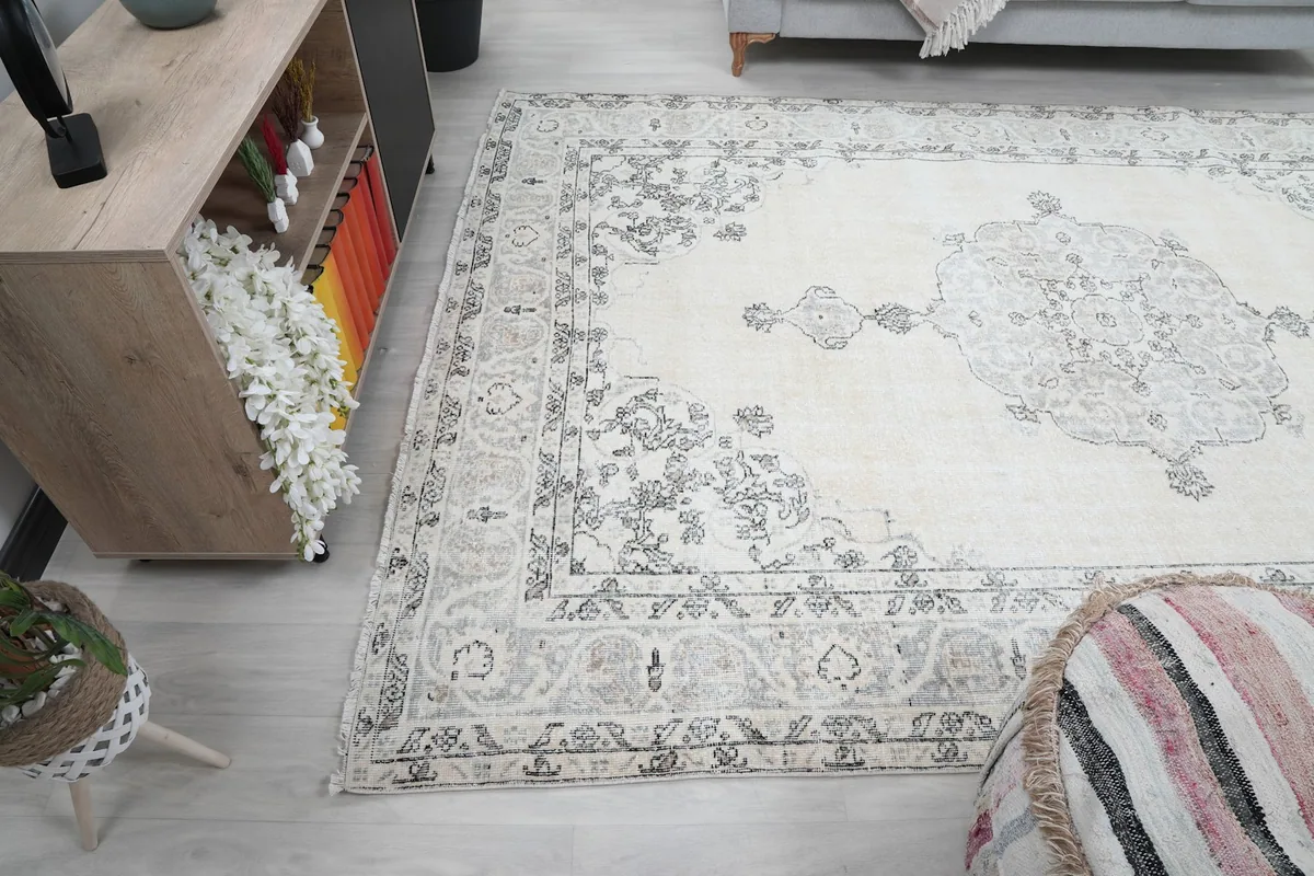 Angled view of the rug and surrounding furniture, emphasizing its large size