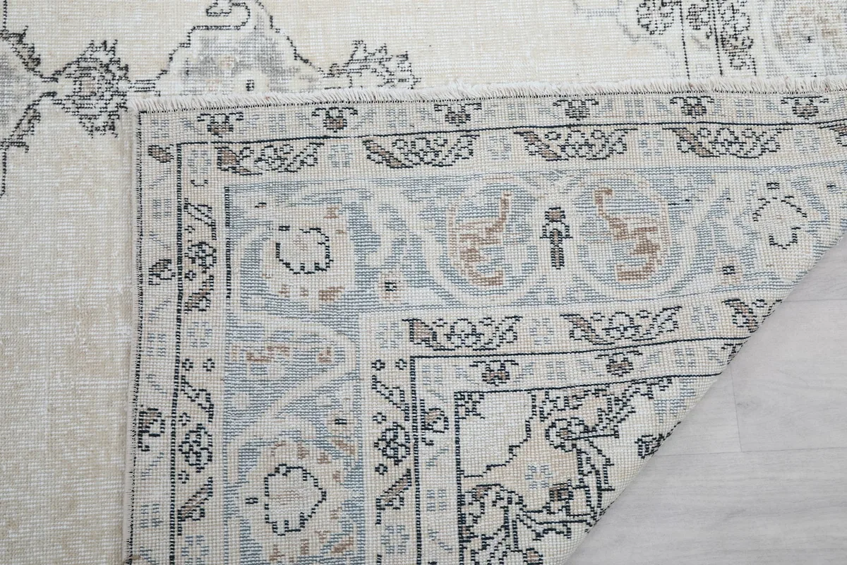 Close-up of the rug's reverse side, showing the dense hand-knotting and foundation