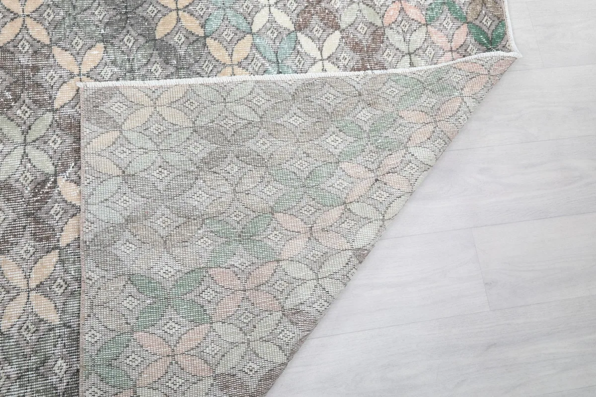 Another view of the rug's underside, showing the reverse side of the hand-knotted wool and cotton