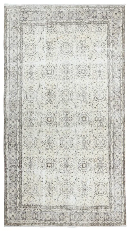 Full top view of the 6'6" x 10'4" ivory and gray vintage Anatolian rug