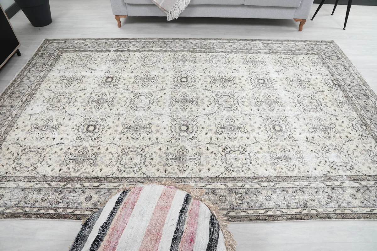 Wide shot of the rug on a light floor, demonstrating its presence in a spacious room