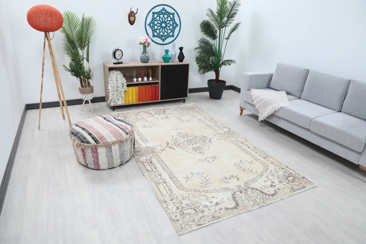 Overhead view of the ivory and charcoal medallion rug placed in a modern living space