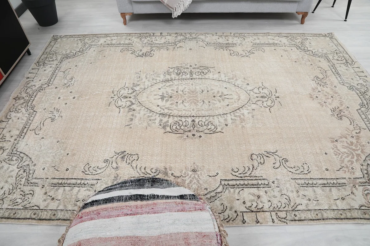 Overhead angle shot of the rug in a room, emphasizing the central medallion design