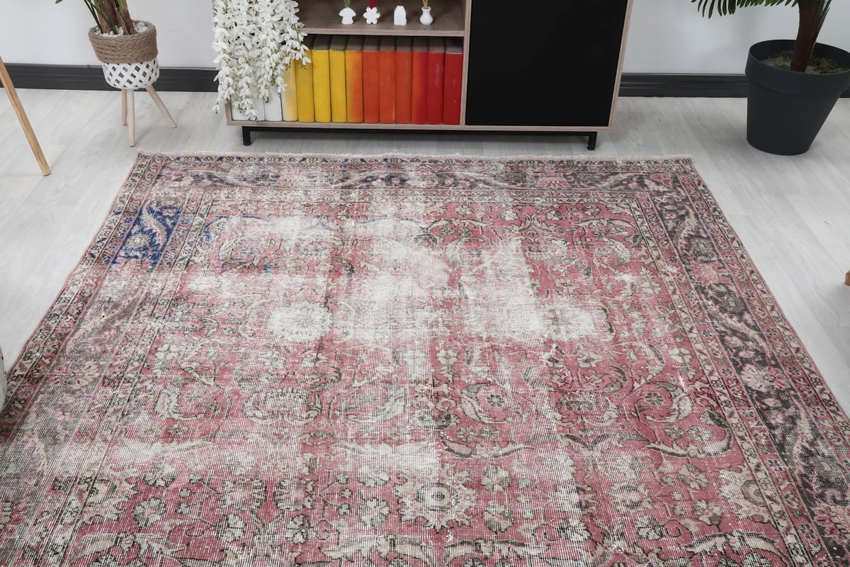 Overhead view of the large vintage rug in a living space with furniture